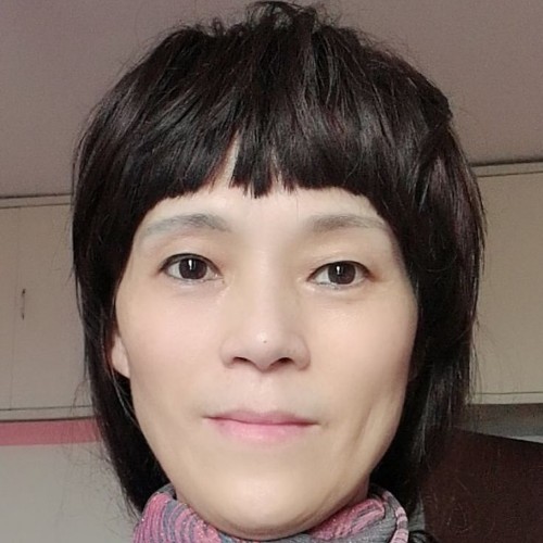 披着袈裟的格桑的照片