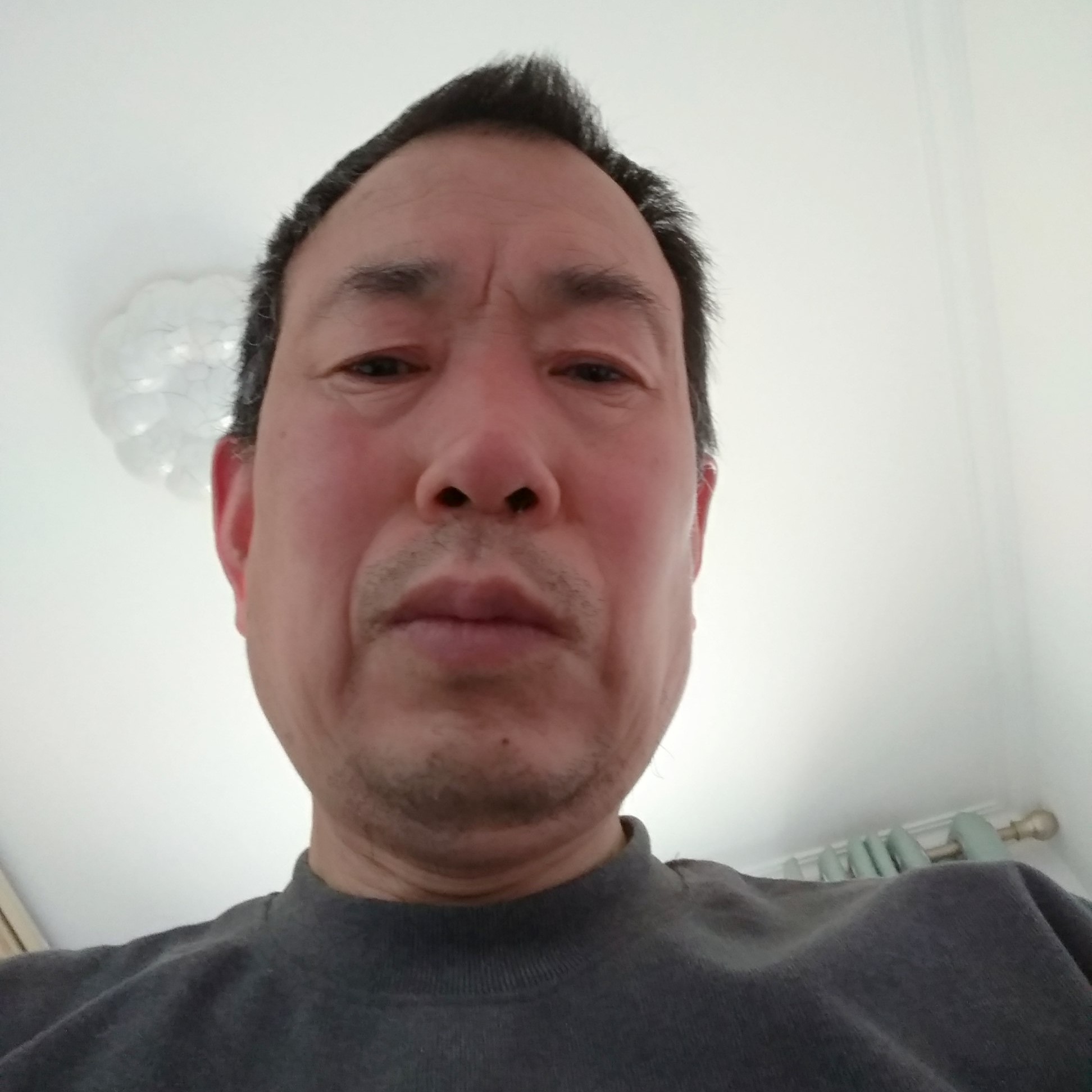 屈立勇的照片